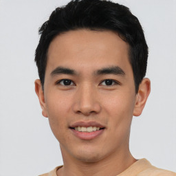 Joyful asian young-adult male with short  black hair and brown eyes