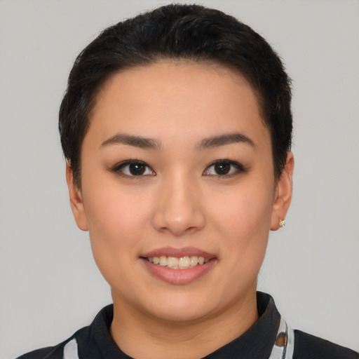 Joyful white young-adult female with short  black hair and brown eyes