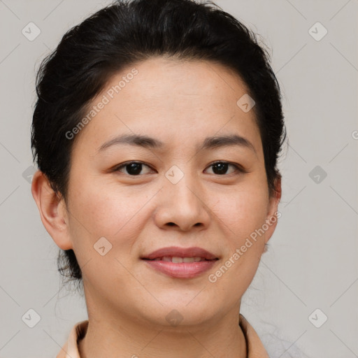 Joyful asian young-adult female with short  brown hair and brown eyes