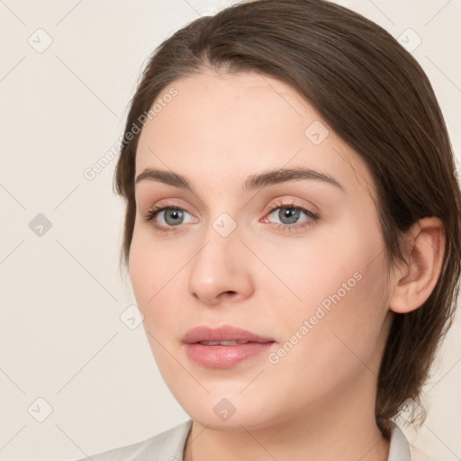 Neutral white young-adult female with medium  brown hair and brown eyes