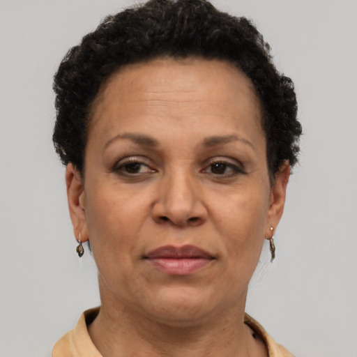 Joyful latino adult female with short  brown hair and brown eyes