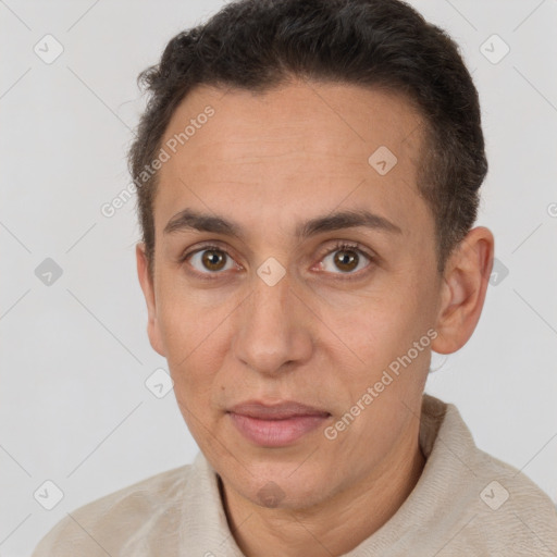 Joyful white adult male with short  brown hair and brown eyes