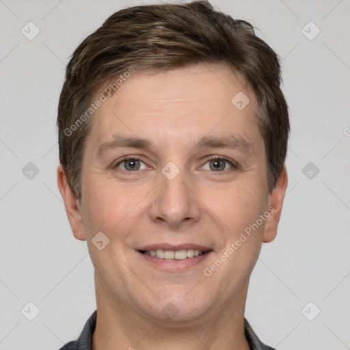 Joyful white adult male with short  brown hair and grey eyes