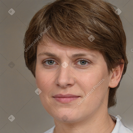 Joyful white adult female with medium  brown hair and grey eyes