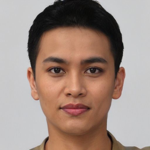 Joyful asian young-adult male with short  black hair and brown eyes