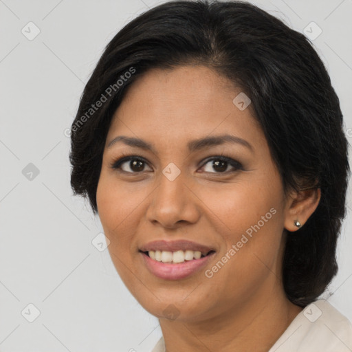 Joyful latino young-adult female with long  brown hair and brown eyes