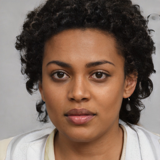 Neutral black young-adult female with medium  black hair and brown eyes