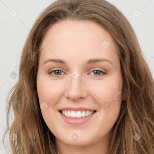 Joyful white young-adult female with long  brown hair and green eyes