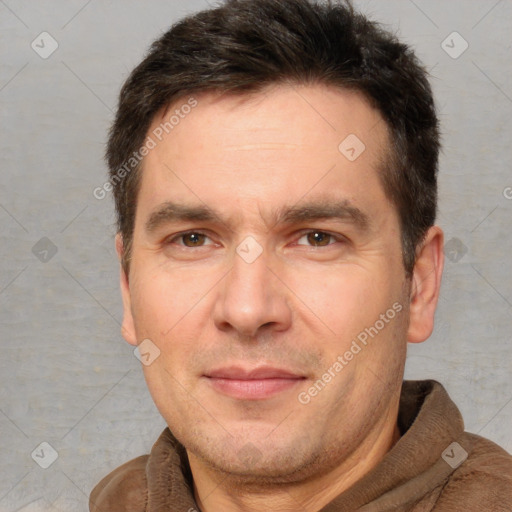 Joyful white adult male with short  brown hair and brown eyes