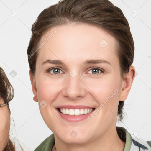 Joyful white young-adult female with medium  brown hair and green eyes