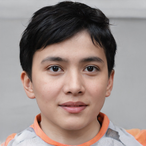Joyful white child male with short  brown hair and brown eyes
