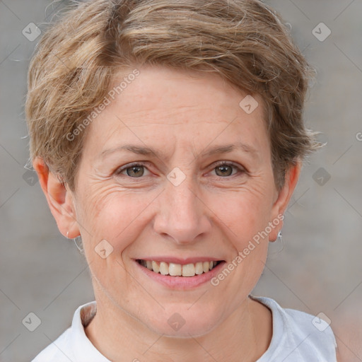 Joyful white adult female with short  brown hair and brown eyes