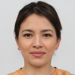 Joyful asian young-adult female with short  brown hair and brown eyes