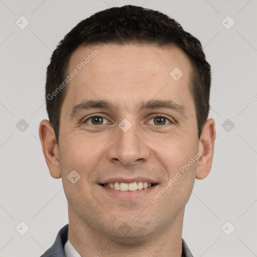 Joyful white young-adult male with short  brown hair and brown eyes