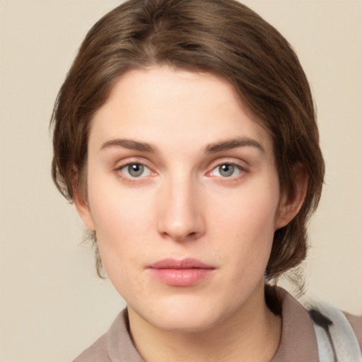 Neutral white young-adult female with medium  brown hair and green eyes