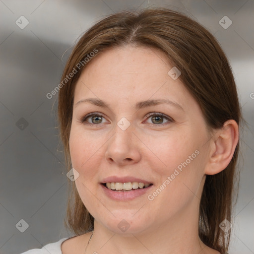 Joyful white adult female with medium  brown hair and grey eyes