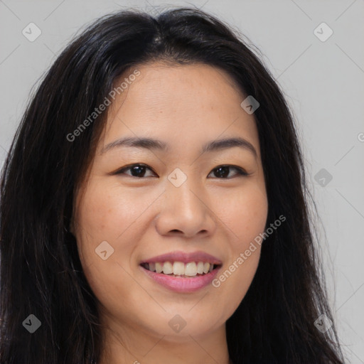 Joyful asian young-adult female with long  brown hair and brown eyes