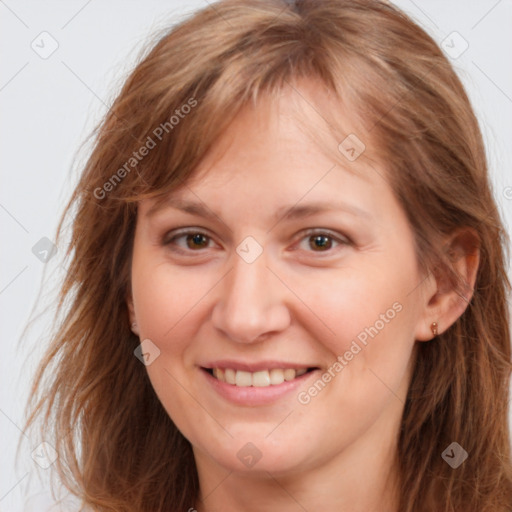 Joyful white adult female with long  brown hair and brown eyes