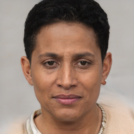 Joyful white adult male with short  black hair and brown eyes