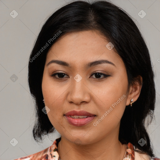 Joyful asian young-adult female with medium  black hair and brown eyes