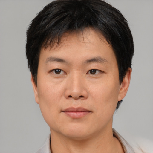 Neutral asian young-adult male with short  black hair and brown eyes