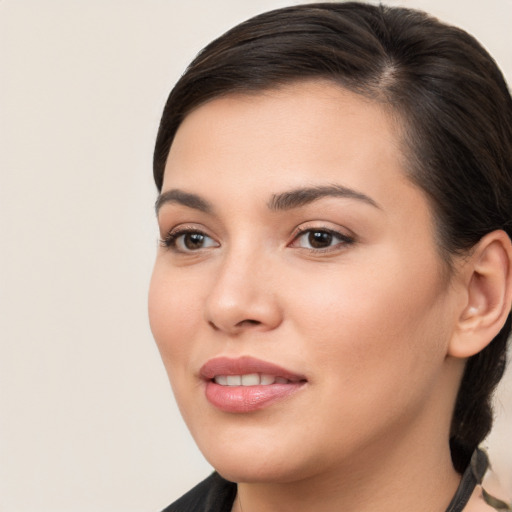 Joyful white young-adult female with medium  brown hair and brown eyes