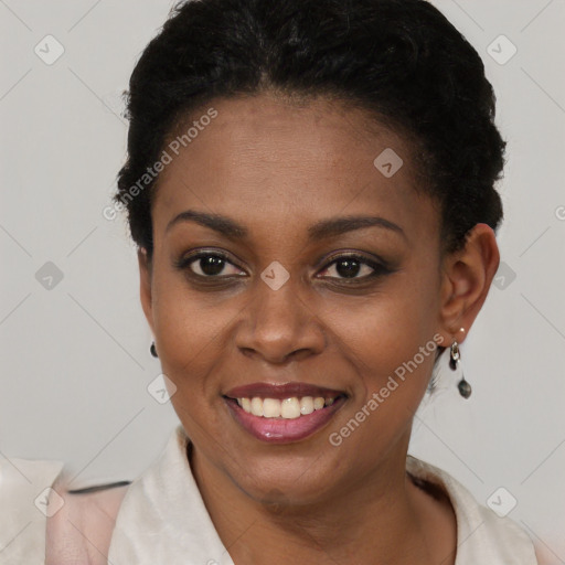 Joyful black young-adult female with short  brown hair and brown eyes