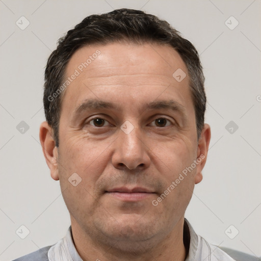 Joyful white adult male with short  brown hair and brown eyes