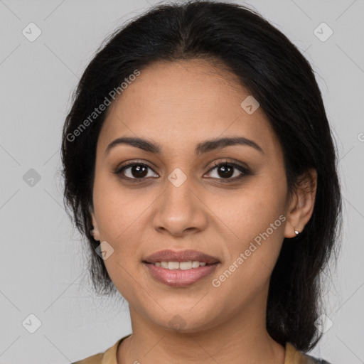 Joyful latino young-adult female with medium  black hair and brown eyes