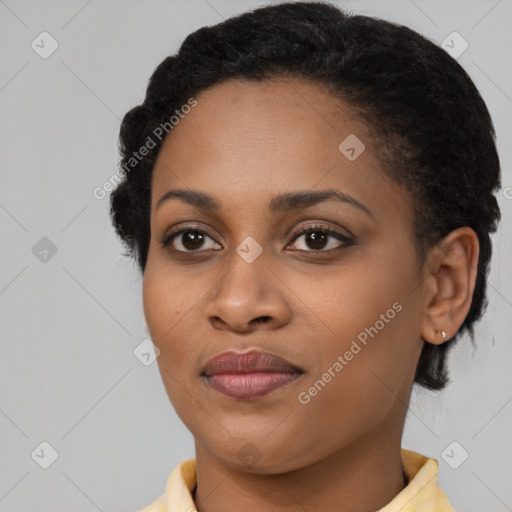 Joyful black young-adult female with medium  brown hair and brown eyes