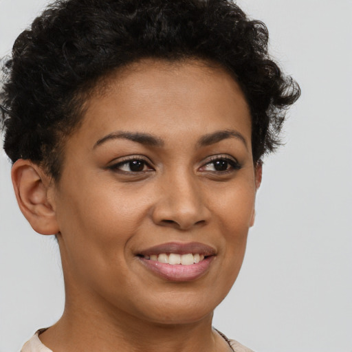 Joyful latino young-adult female with short  brown hair and brown eyes