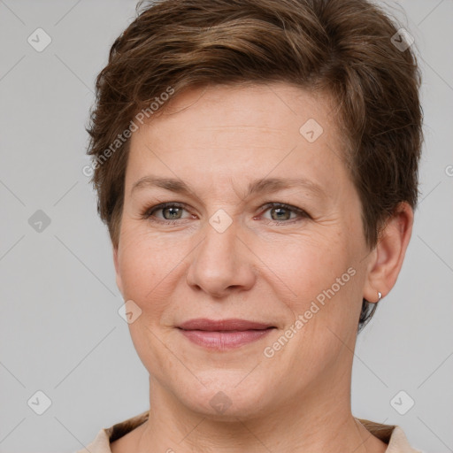 Joyful white adult female with short  brown hair and grey eyes