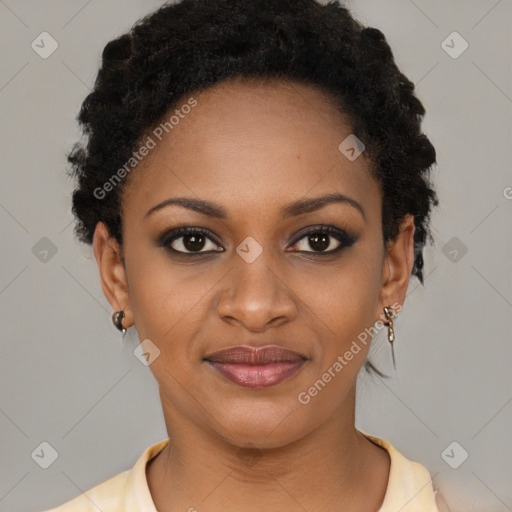 Joyful black young-adult female with short  black hair and brown eyes