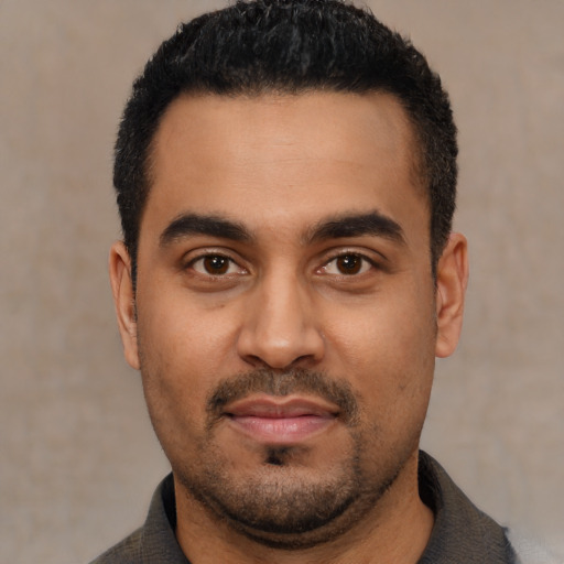 Neutral latino young-adult male with short  black hair and brown eyes