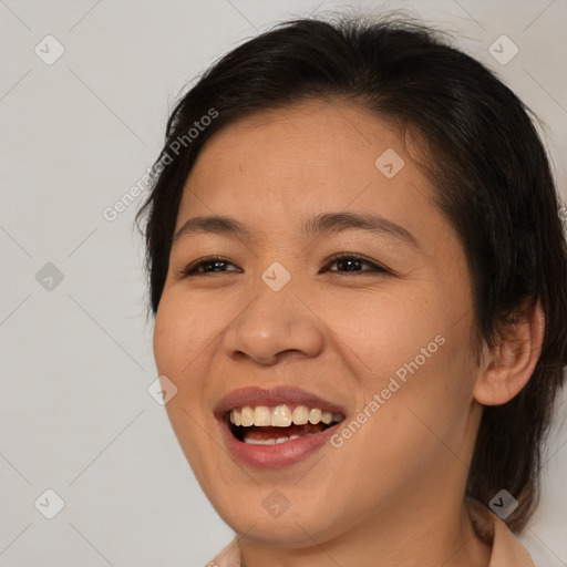 Joyful asian young-adult female with medium  brown hair and brown eyes