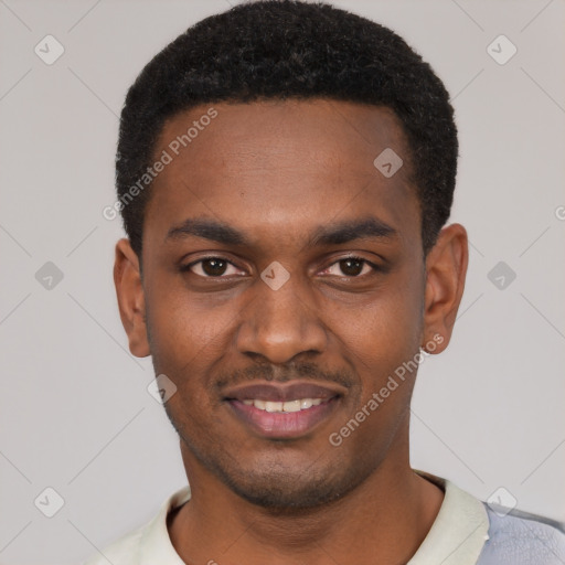 Joyful black young-adult male with short  black hair and brown eyes