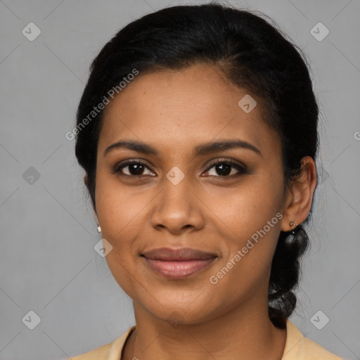 Joyful black young-adult female with medium  black hair and brown eyes