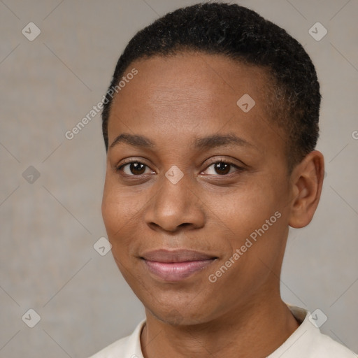 Joyful black young-adult female with short  brown hair and brown eyes