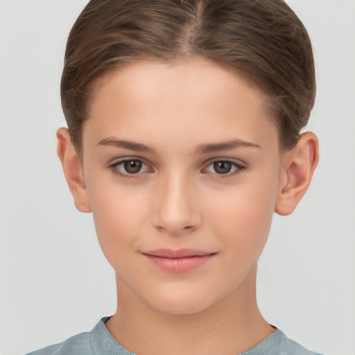 Joyful white child female with short  brown hair and brown eyes