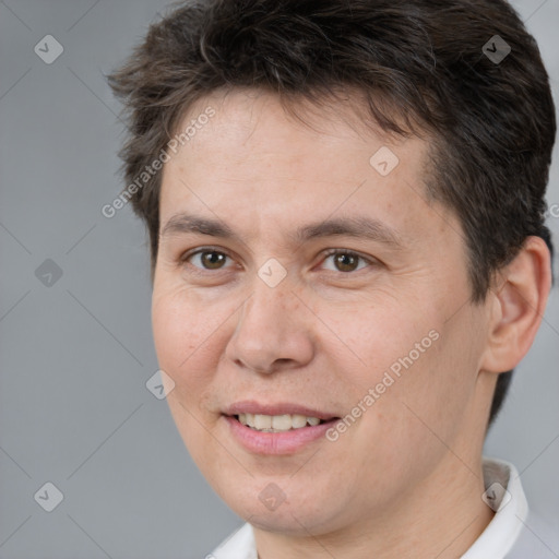 Joyful white adult male with short  brown hair and brown eyes