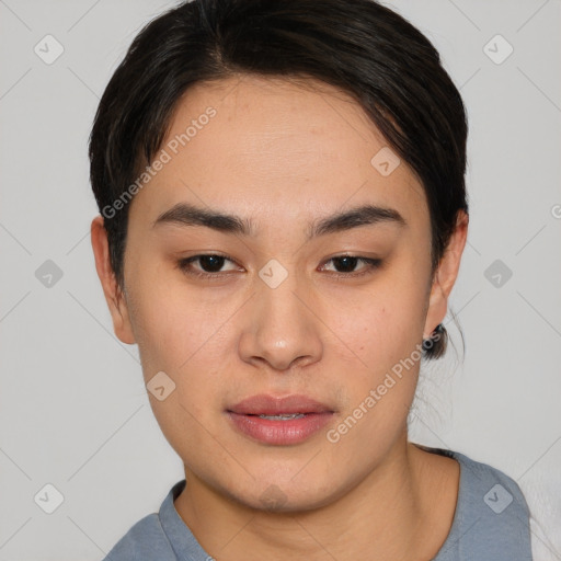 Joyful asian young-adult female with short  brown hair and brown eyes