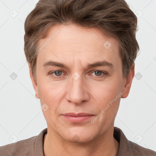 Joyful white adult male with short  brown hair and grey eyes