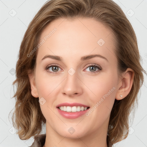 Joyful white young-adult female with medium  brown hair and blue eyes