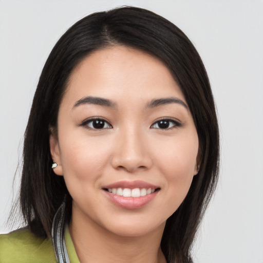 Joyful white young-adult female with long  black hair and brown eyes