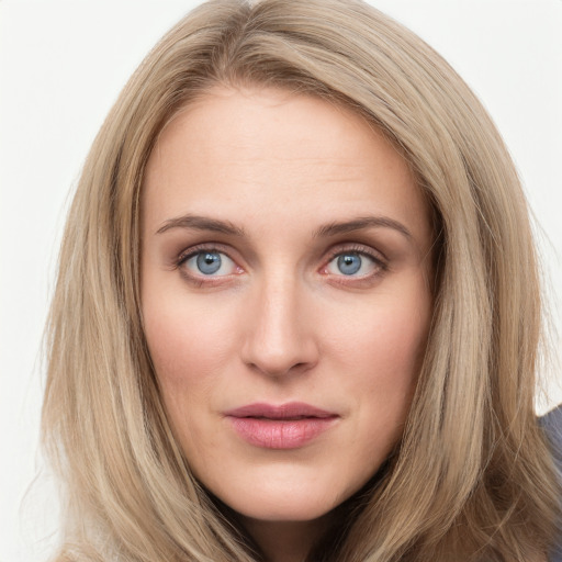 Joyful white young-adult female with long  brown hair and blue eyes