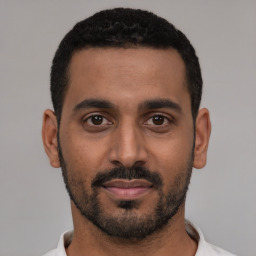 Neutral black young-adult male with short  black hair and brown eyes