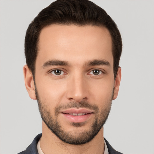 Joyful white young-adult male with short  brown hair and brown eyes