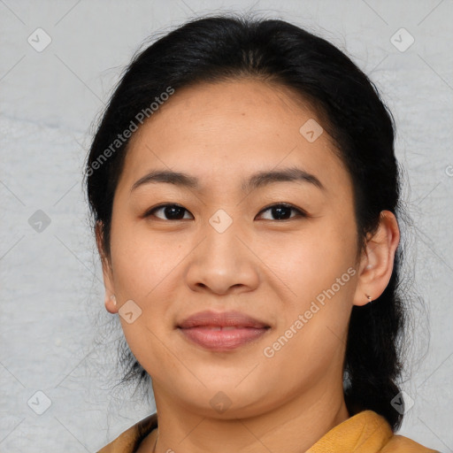 Joyful asian young-adult female with medium  brown hair and brown eyes