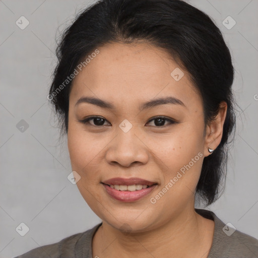 Joyful asian young-adult female with medium  black hair and brown eyes