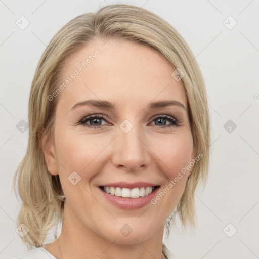 Joyful white young-adult female with medium  brown hair and blue eyes